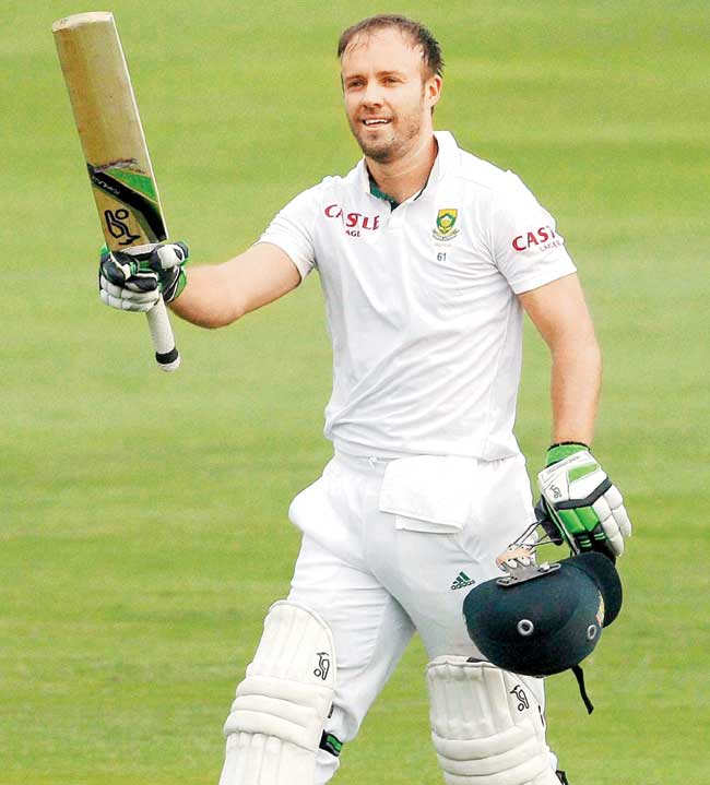 AB de Villiers celebrates his 100 against WI yesterday. Pic/AFP