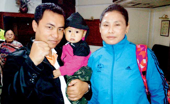 Boxer Sarita Devi with son Tomthil and husband Thoiba Chongtham