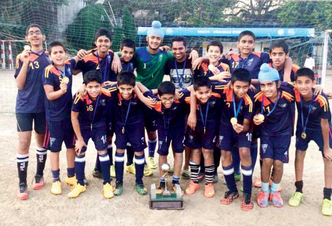 Arya Vidya Mandir (Bandra) celebrate their U-14 Div IV title at Azad Maidan yesterday