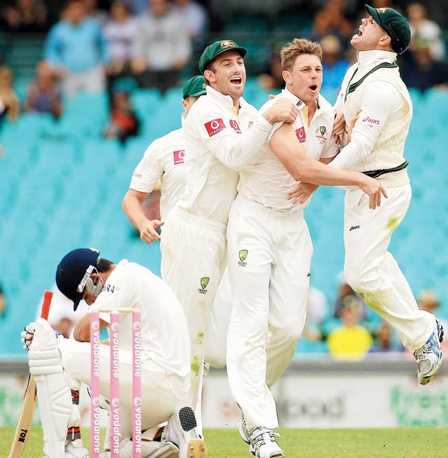 Australian players celebrate the wicket of Virat Kohli on Day Four of the Sydney Test in January 2012. Pic/Getty Images