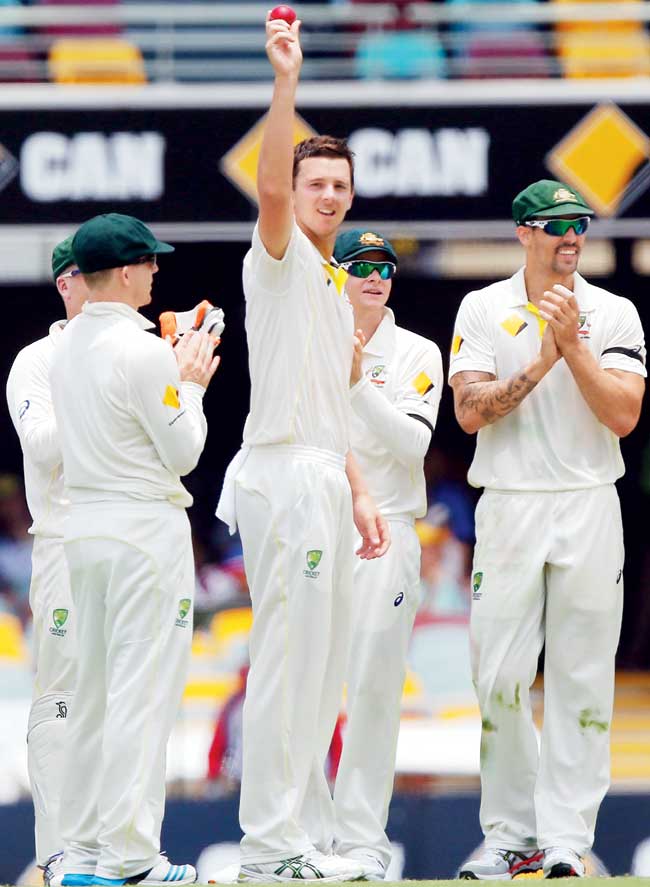 Josh Hazlewood acknowledges the crowd after taking his fifth wicket at the Gabba yesterday. Pic/Getty Images