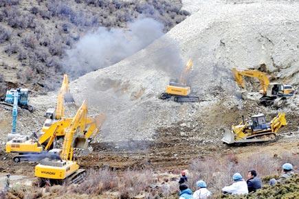 Over 200 trapped in Tibet landslides