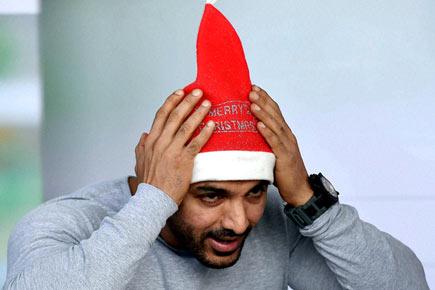 John Abraham dons the Santa cap for charity