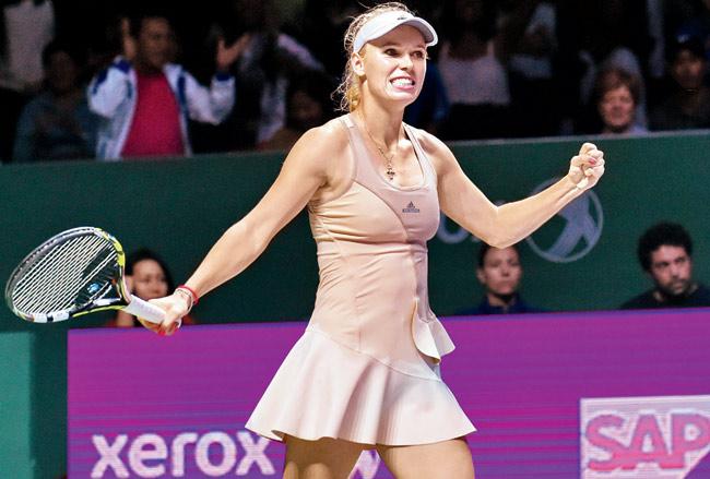 Caroline Wozniacki celebrates her win yesterday