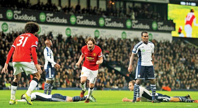 Daley Blind (centre) celebrates scoring Man United’s second goal against West Bromwich Albion at The Hawthorns on Tuesday. Pic/AFP