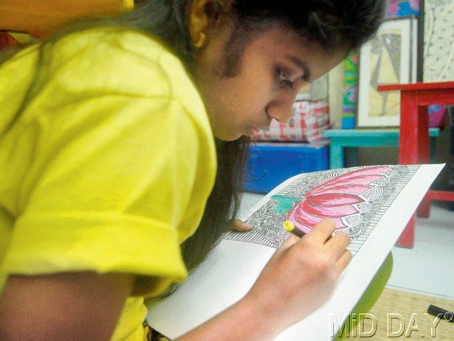 Jyoti paints an art work that will go on sale as Akanksha’s Diwali products