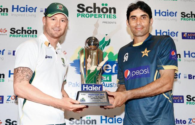 Australia skipper Michael Clarke and Pakistan captain Misbah-ul-Haq pose with the trophy yesterday. Pic/Getty Images