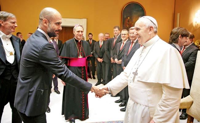 Pope Francis greets FC Bayern Munich head coach Josep Guardiola at the Vatican yesterday. Pic/AFP
