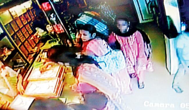 Clean sweep: The CCTV of the store caught images of the gang in operation at the jewellery store in Talegaon. The cops are currently going through the footage 