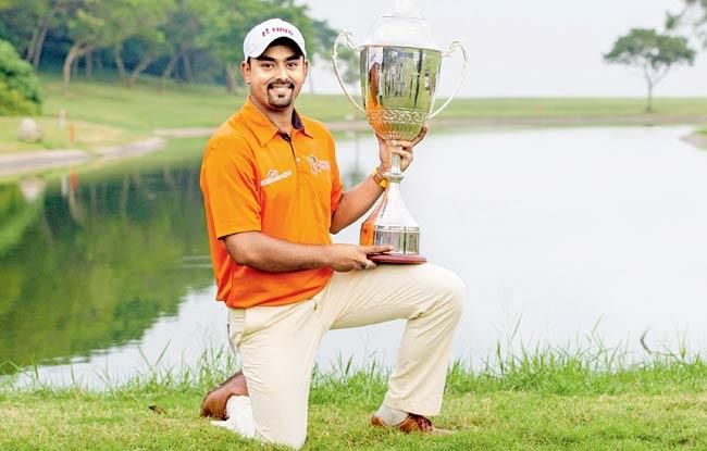 Anirban Lahiri poses with the Macau Open trophy yesterday. Pic/AFP