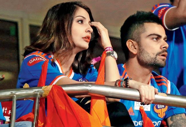 Actor Anushka Sharma with FC Goa co-owner and India cricketer Virat Kohli sport a serious look as their team battle it out against FC Pune City in the Indian Super League yesterday.  Pics/ ISL/ Sportzpics 