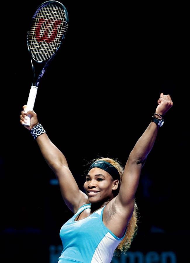 Serena Williams celebrates her WTA Finals victory over Simona Halep yesterday. Pic/Getty Images