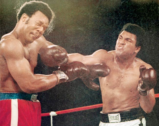 Take that: Muhammad Ali (right) lands a punch on George Foreman in Zaire (now Conga) on October 10, 1974. This image is part of a photograph that appeared on the cover of the November 11, 1974 issue of Sports Illustrated magazine. Pic/Getty Images