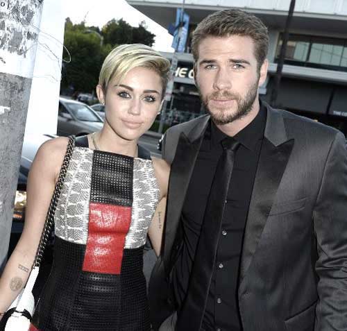 Miley Cyrus and Liam Hemsworth. Pic/AFP