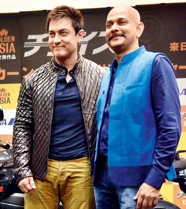 Aamir Khan and director Vijay Krishna Acharya in Tokyo. Pic/PTI