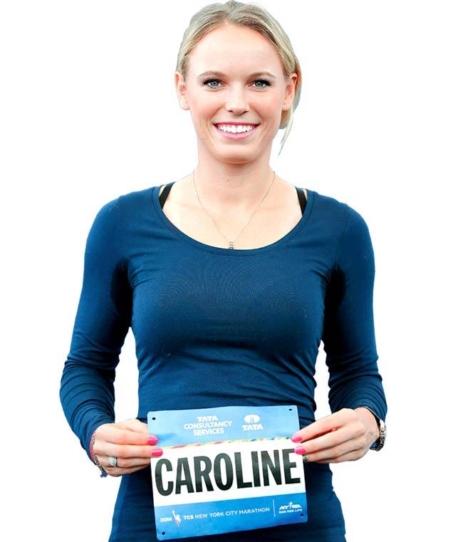 Ready to run: Tennis ace Caroline Wozniacki poses with her New York Marathon race bib at a promotional event in New York on Wednesday. Pic/Getty Images