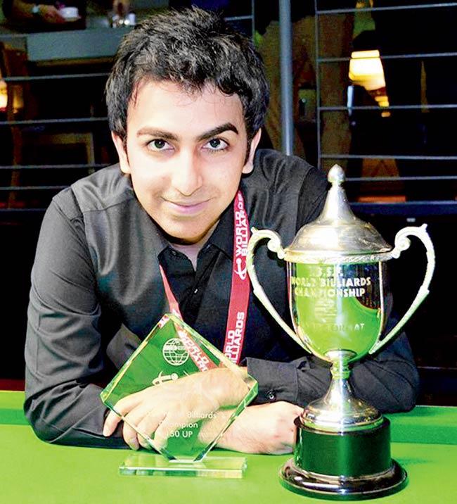 My day! Pankaj Advani poses for photographers after winning the World Billiards Championship (time format) in Leeds yesterday. Pic/PTI