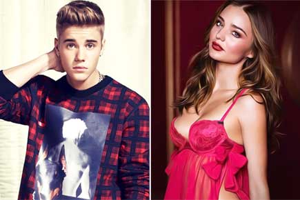 Justin Bieber avoids Miranda Kerr at Paris party