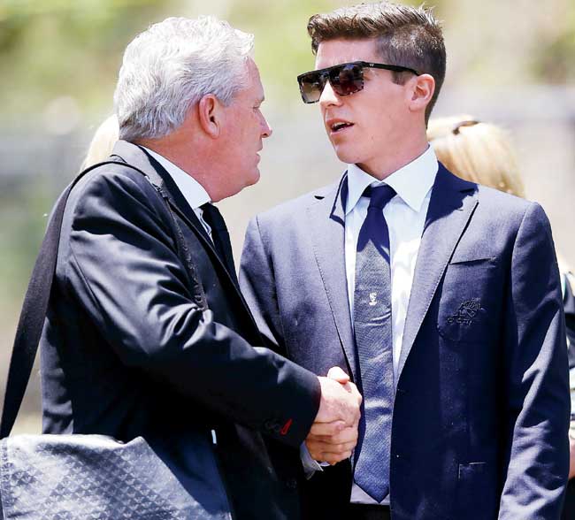 Dean Jones (left) greets Sean Abbott before the funeral service in Macksville. Pic/Getty Images