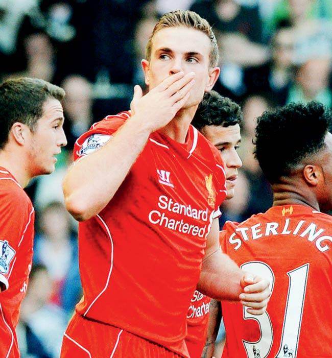 Jordan Henderson celebrates after scoring Liverpool