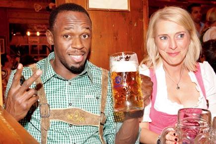 Beer and blonde as Usain Bolt gets wild at Oktoberfest
