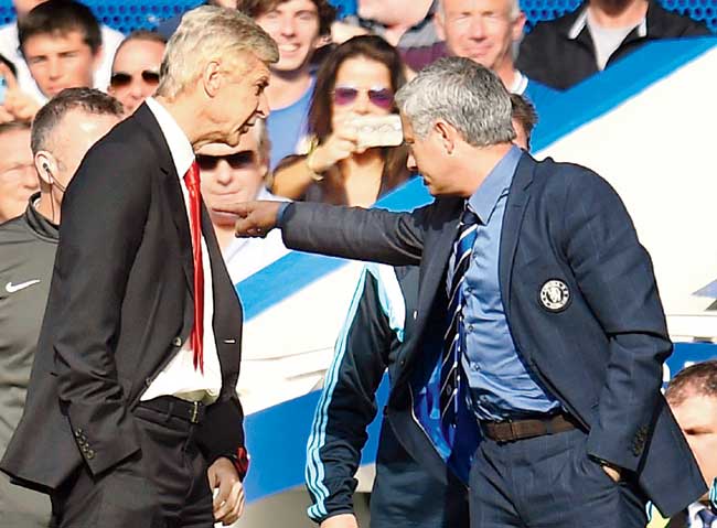 Chelsea manager Jose Mourinho tells Arsenal boss Arsene Wenger to "back off" during the tie. Pics/Getty Images