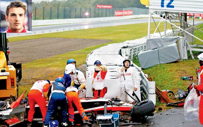 Inset Marussia driver Jules Bianchi moments before the start of the Japanese GP yesterday. Emergency medical teams attend to 25-year-old Bianchi after the Frenchman crashed during the Suzuka Grand Prix yesterday. The young driver suffered a severe head injury. Pics/Getty Images