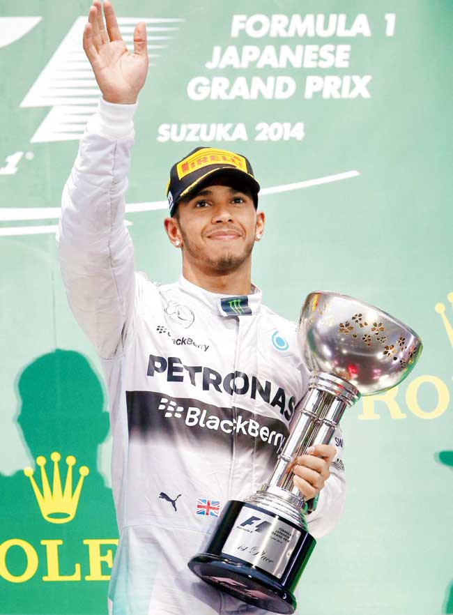 Mercedes- Lewis Hamilton atop the podium after winning the Japanese GP yesterday