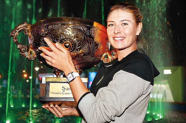 Maria Sharapova poses with the winner