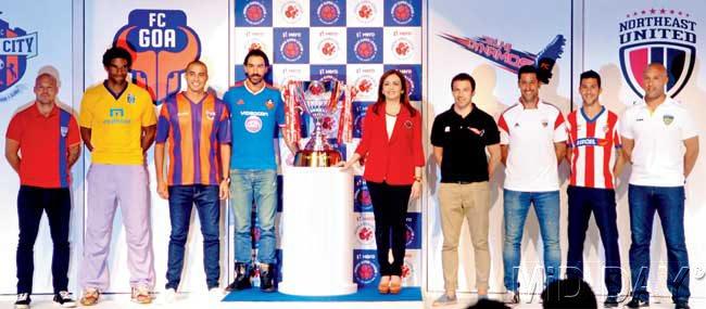 Chairperson of Football Sports Development, Neeta Ambani centre unveils the Indian Super League trophy with icon players of eight ISL clubs — Mumbai City FC-s Fredrik Ljungberg extreme left, David James of Kerala Blasters, David Trezeguet of Pune City FC, Robert Pires of FC Goa, Alessandro Del Piero of Delhi Dynamos FC, Joan Capdevila of North East United FC, Luis Garcia of Atletico de Kolkata and Mikael Silvestre of Chennaiyin FC extreme right at a city hotel yesterday. Pic/Shadab Khan