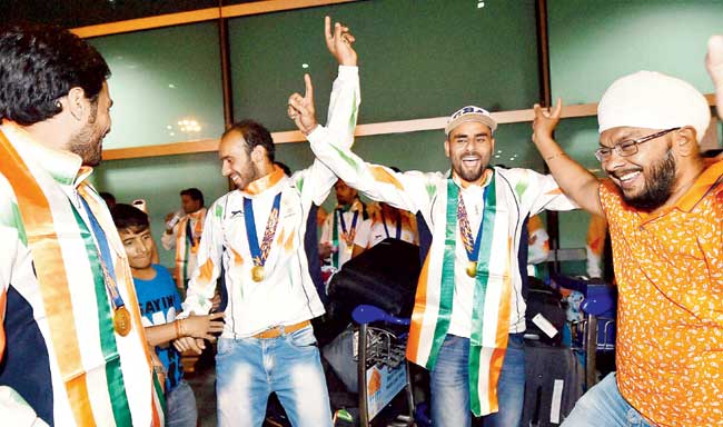 Indian forwards Ramandeep Singh (left) and Gurvinder Singh Chandi dance on arrival at the IGI airport in Delhi. Pic/PTI