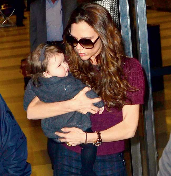 Victoria Beckham with  daughter Harper in New York on February 7,  2012. Pic/Getty Images 