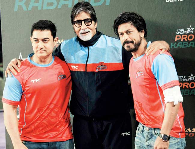 Actor Amitabh Bachchan is flanked by co-actors Aamir Khan (left) and Shah Rukh Khan during the Pro Kabaddi League recently