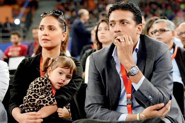 IPTL founder Mahesh Bhupathi with actress wife Lara Dutta and daughter Saira catch Day One action of the India leg of the tournament in New Delhi on Saturday. Pic/PTI