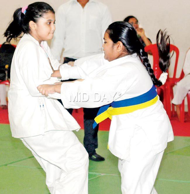 Prachi Shah (left) in action against Prarthna Bhoi during their girls U-10 judo clash at Dharavi yesterday. Pic/Sameer Markande