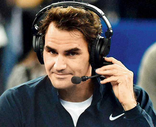 Roger Federer does a post-match interview yesterday. Pics/Getty Images