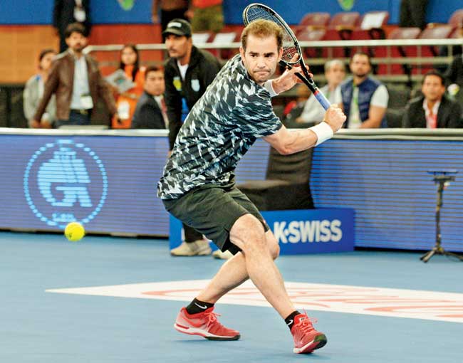 American Pete Sampras of the Indian Aces lines up a backhand during his IPTL match in New Delhi on Sunday night. Pic/PTI