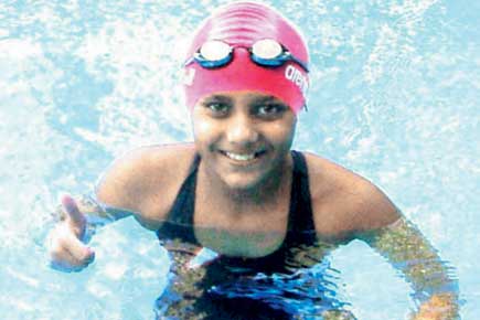 Sanjiti sets three swimming records