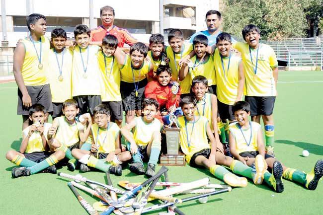 St Stanislaus with the U-14 FrDonnelly Challenge Cup at the MHAL Stadium in Churchgate yesterday. Pic/Sresh KK