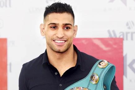 Boxer Amir Khan keen to help Pak pick up the pieces