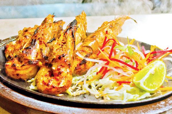  Nasiley Jhinge are brandy spiked jumbo prawns, fresh out of the tandoor