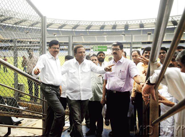 MCA CEO C S Naik (left) takes a round of the stadium with city BJP chief Ashish Shelar and other BJP leaders yesterday. Pics/Pradeep Dhivar