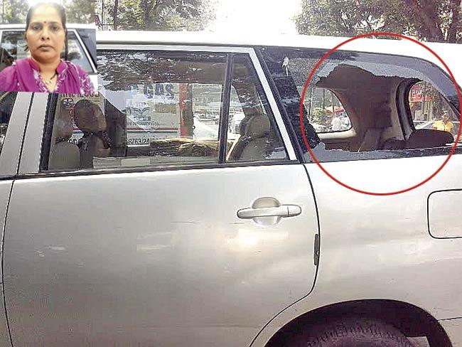Burglars smashed one of the windows (circled) of the Innova owned by Rachana Agarwal, and made off with the booty