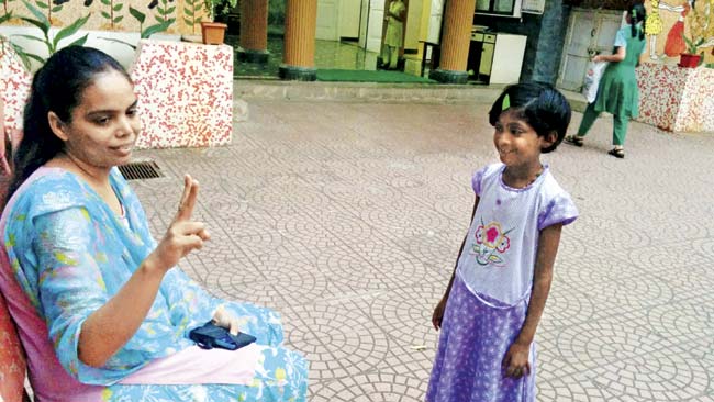 She counts fingers at her school in Dadar