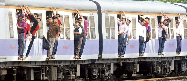 Hanging out of trains is a common happening, automatic doors will add to troubles feel commuters