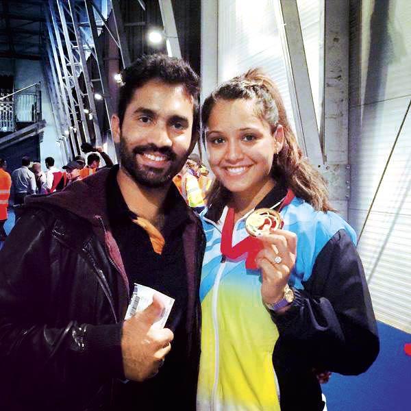 Squash ace Dipika Pallikal with fiance Dinesh Karthik after she won gold at the Glasgow CWG in August