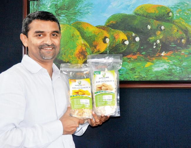 Joseph with the packs of JackFruit365; this was his start-up venture offering freeze-dried ripe jackfruit. He won the Start-up Entrepreneur Of The Year award for this at TiEcon Kerala