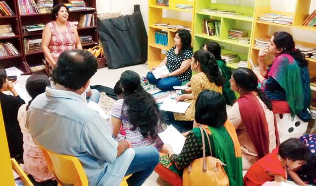 A community discussion session in progress at a JustBooks outlet in the city