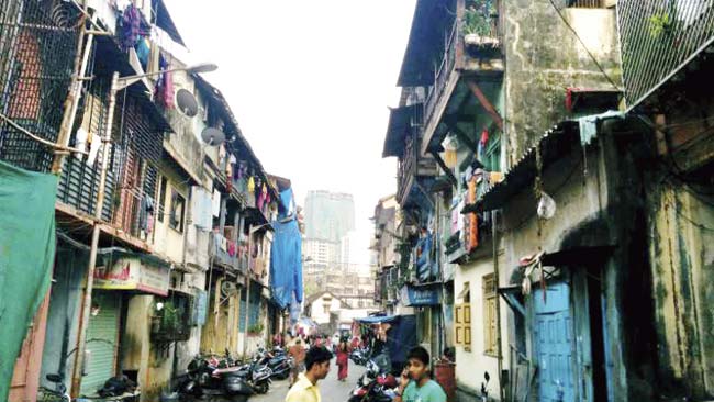 The dingy bylanes of Kamathipura and a high-rise coming up in the background