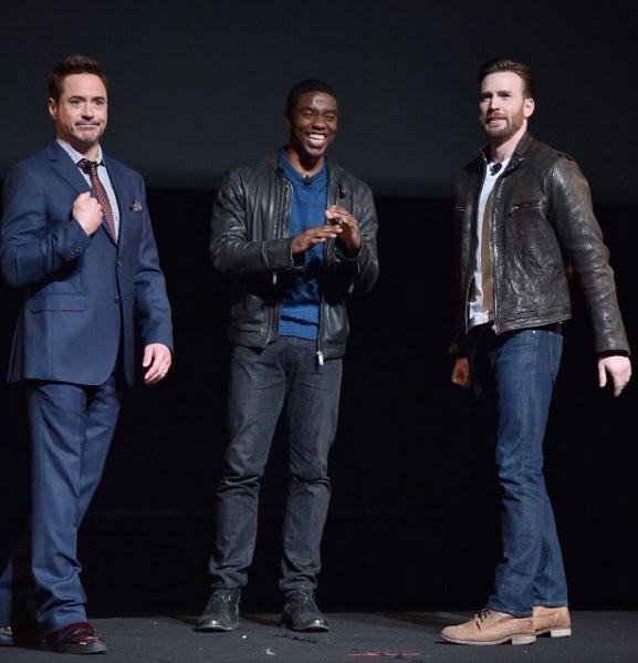 Robert Downey Jr., Chadwick Boseman and Chris Evans onstage during Marvel Studios fan event in Los Angeles